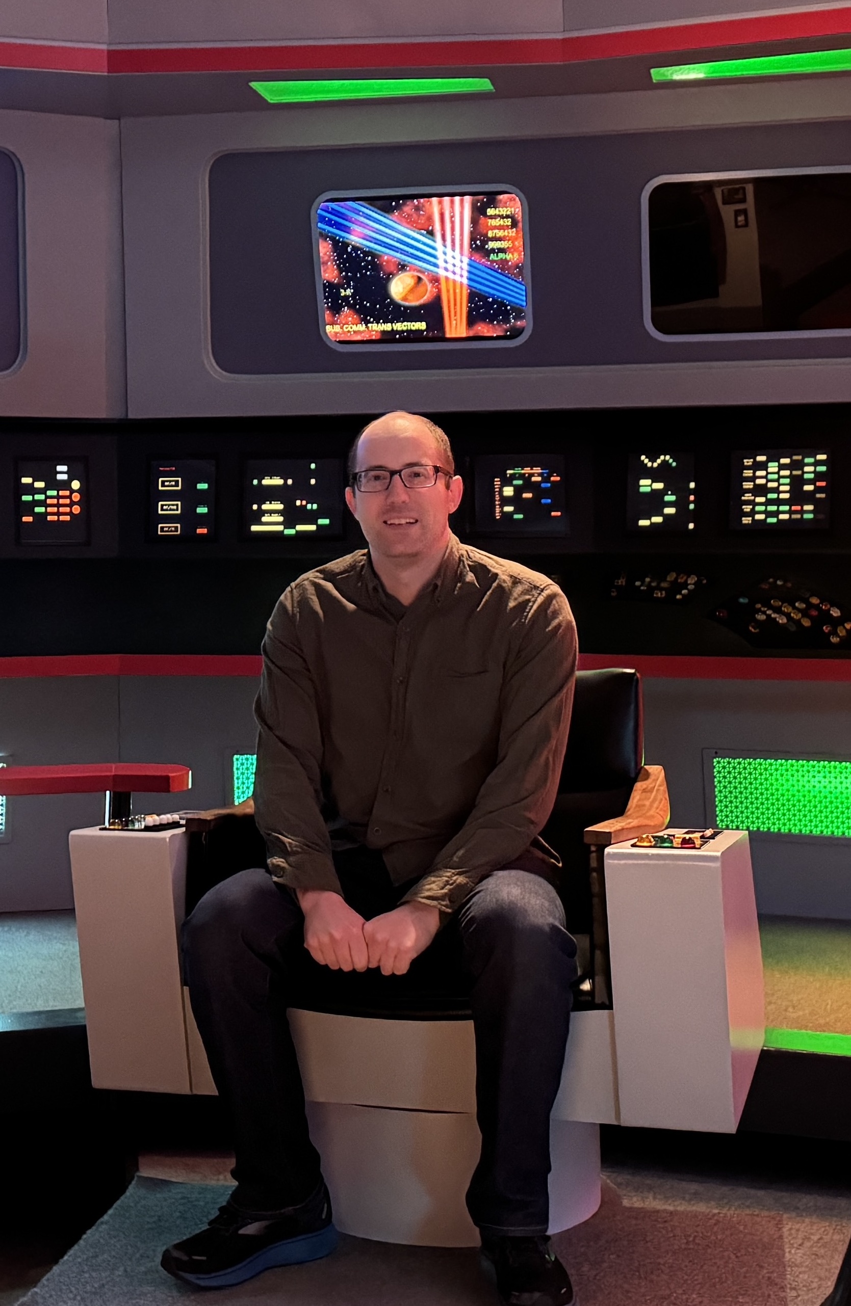 Dan Elton in a Star Trek uniform on the bridge of the Enterprise
